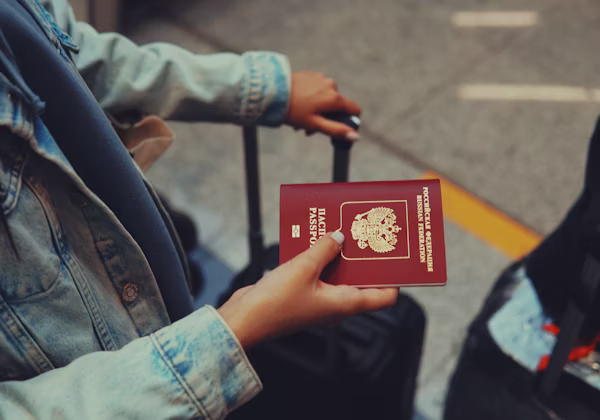 A traveller holding a passport