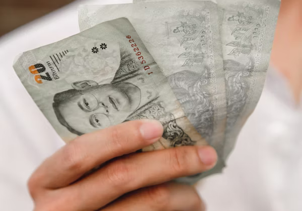 Thai baht and bills on a table