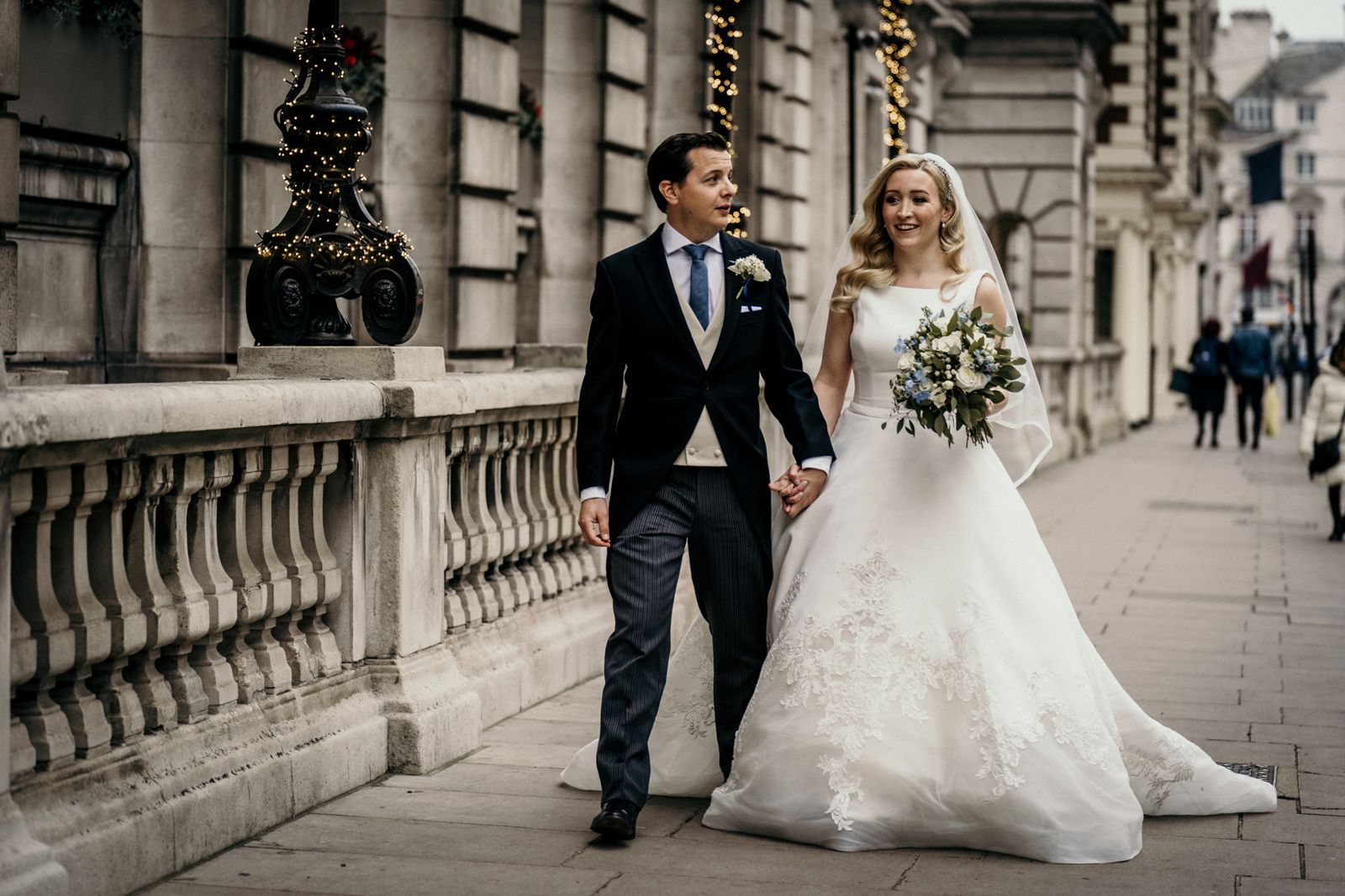 Wedding couple walking through the city